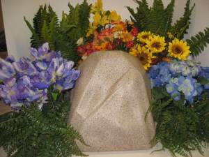 Watering Rock surrounded by plants